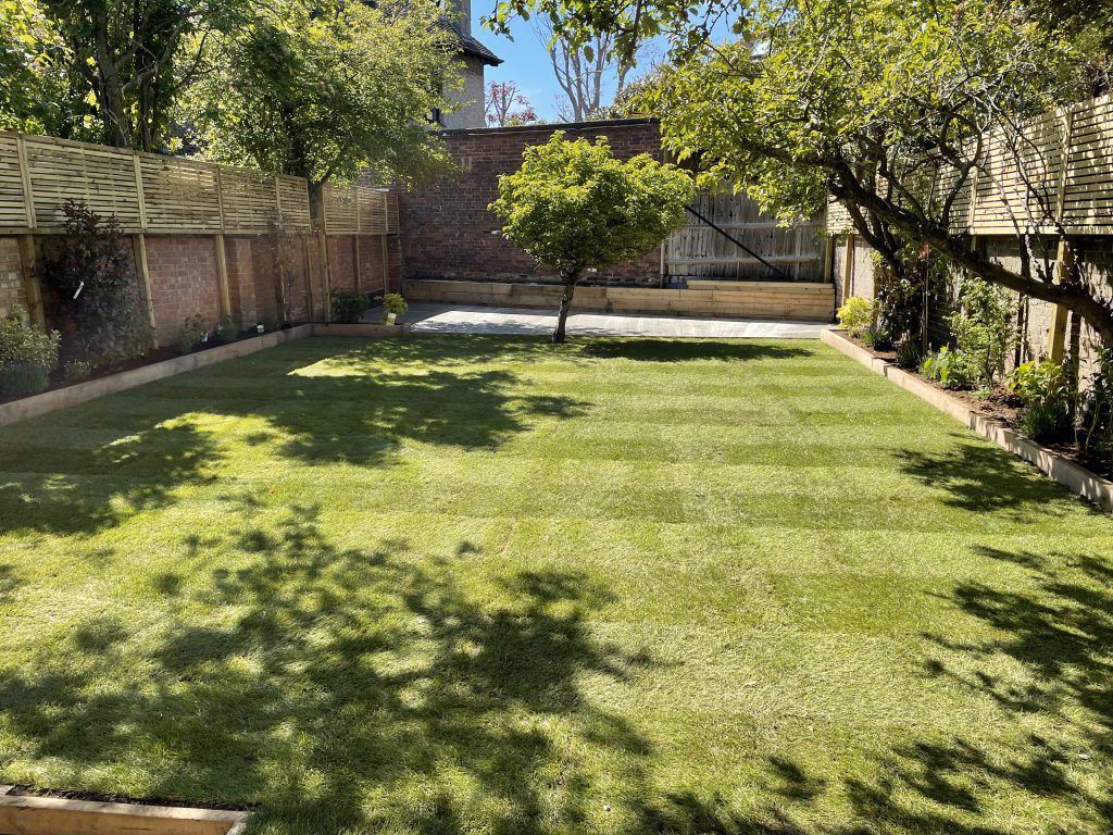 Garden levelled plus topsoil and re-turfed